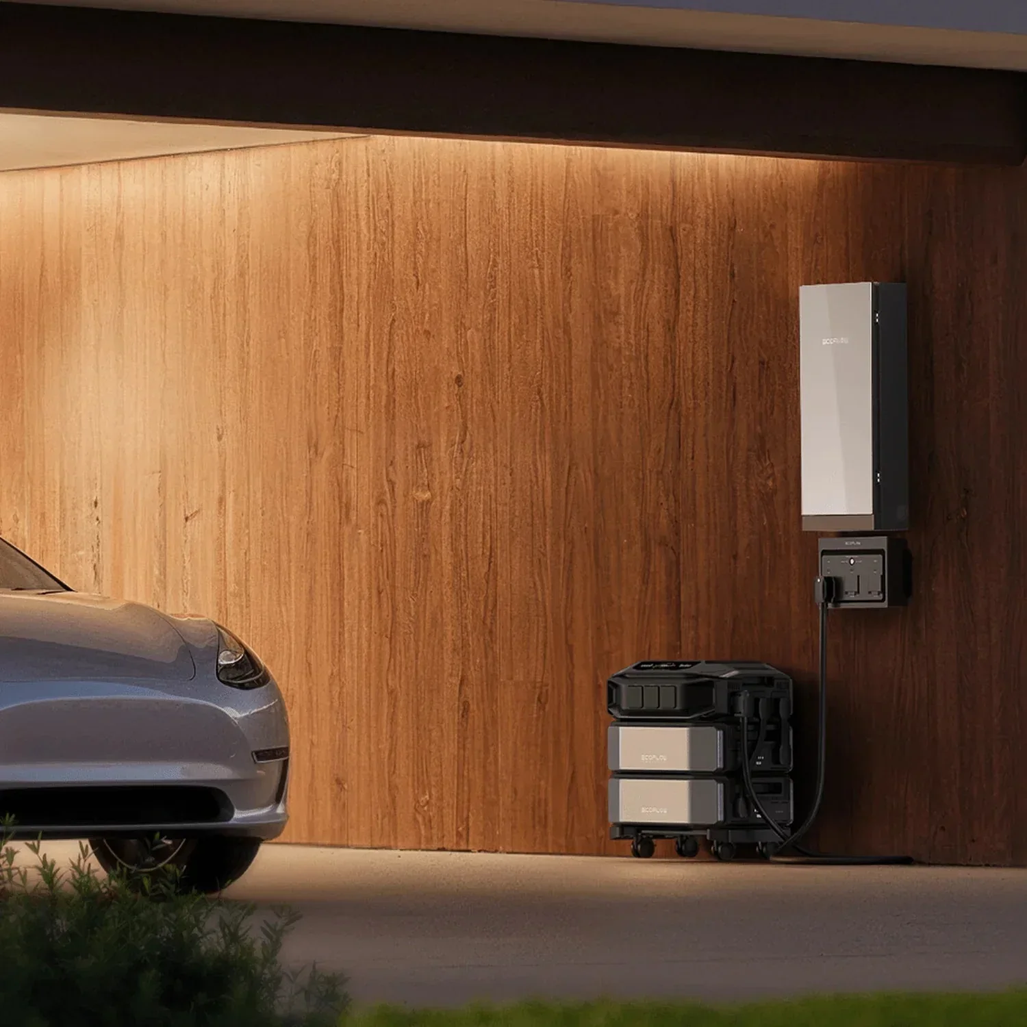 EcoFlow home battery system mounted on a wood-paneled garage wall at dusk